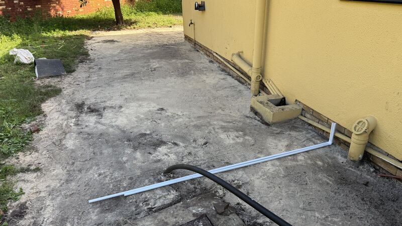 Pipe runs along the wall exposed and checked before paving